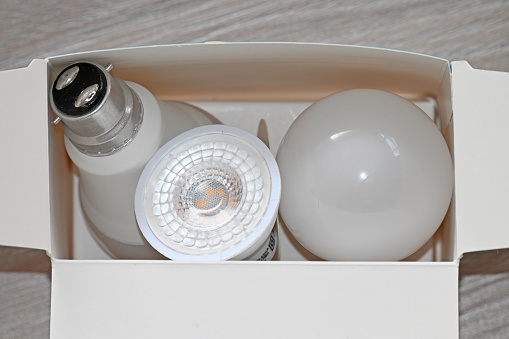 Assorted Led light globes in a cardboard box