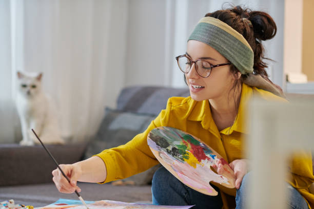 istock A female artist working in the studio 1367101755