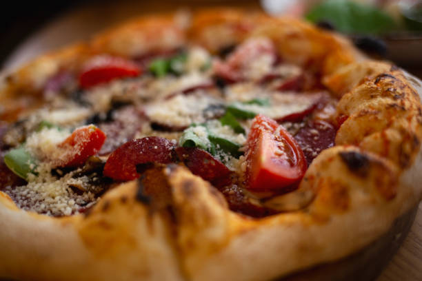 istock delicious fresh pizza with salami, basil and tomatoes 1367101839