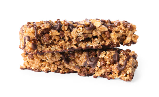 istock Crunchy granola bars with chocolate on white background 1367102629