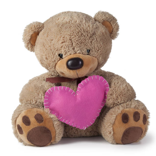 Toy teddy bear gives gifts on a white background stock photo