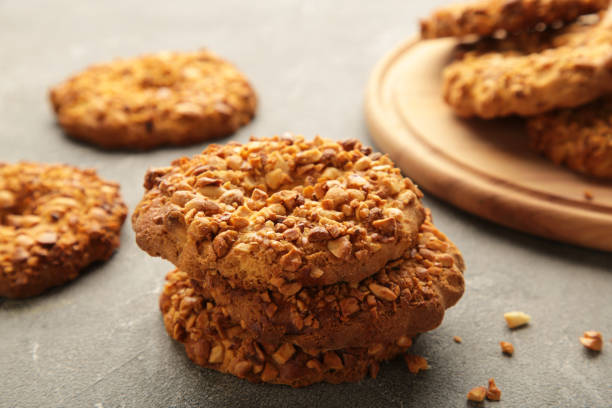 istock Peanut cookies on cutting board on grey background. Bakery products. 1367103966