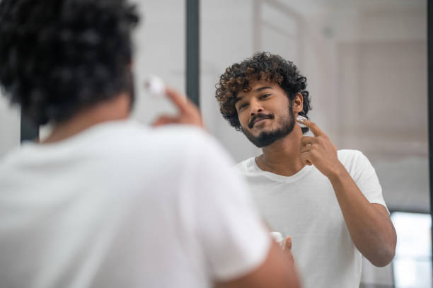 istock Pleased concentrated young male preparing for shaving 1367104177