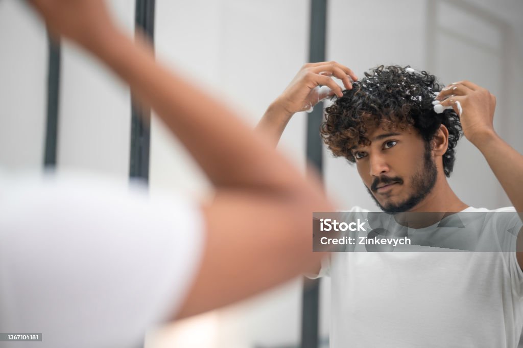 Male Rubbing The Hairstyling Product Into His Curls Stock Photo - Download  Image Now - iStock