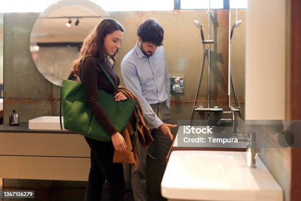 A Couple Visits A Showroom Stock Photo - Download Image Now - Bathroom, Decoration, Exhibition
