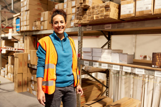 istock A female worker stands in a warehouse. 1367106315
