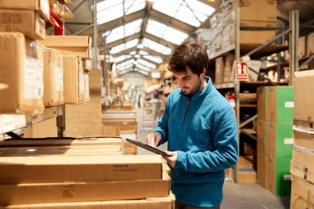 istock A warehouse worker takes inventory with a digital tablet. 1367106323