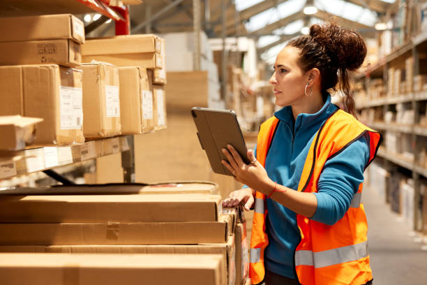 istock A warehouse worker takes inventory in the storage room. 1367106337