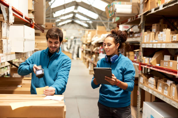 istock A manager and a Warehouse worker organize the shelves. 1367106383
