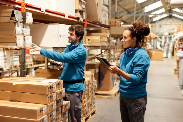 istock A manager and a Warehouse worker organize the shelves. 1367106410