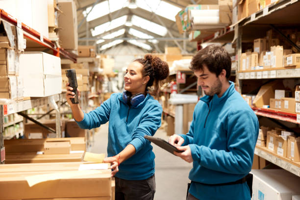 istock A manager and a Warehouse worker organize the shelves. 1367106422