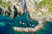 drone aerial view of Riomaggiore is a village and comune in the province of La Spezia, situated in a small valley in the Liguria region of Italy