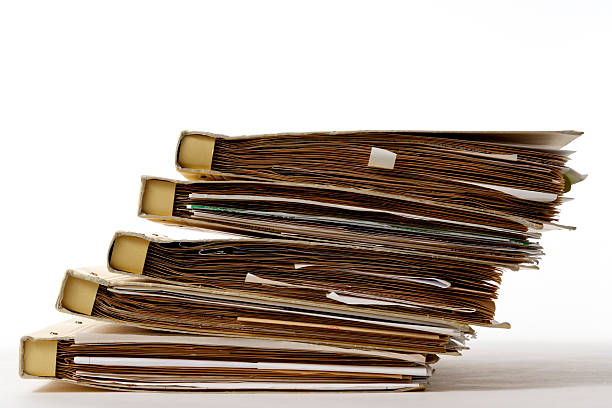 istock Isolated shot of stacked file folders on white background 136711770