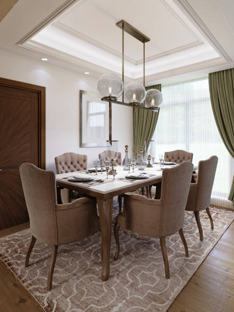 istock Dining table for six with soft brown chairs and a wooden server table and glass pendant light. 1367117717
