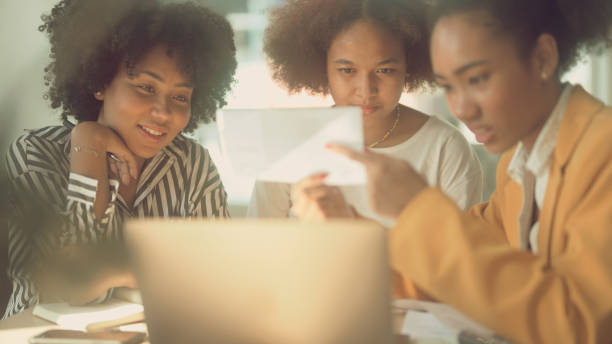 istock Group of women studying e-learning about taxes 1367117740