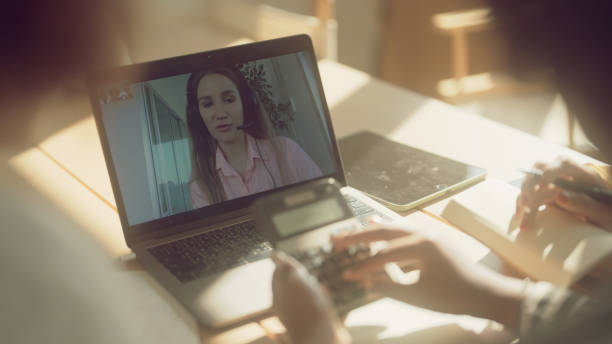 istock Group of women studying e-learning about taxes 1367117831