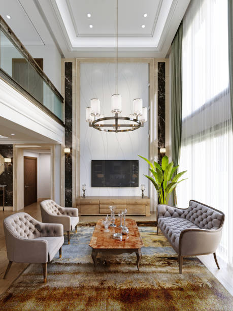тв-зона с роскошной мебелью для сидения в классическом интерьере с большими окнами и высокими потолками. - luxury home стоковые фото и изображения