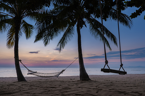 Na Jomtien Beach Pattaya Thailand, swing on the tropical beach during sunset in Pattaya