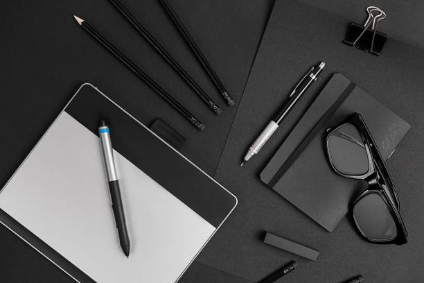 istock Blank notepad with clips, pens and glasses flat lay 1367119289
