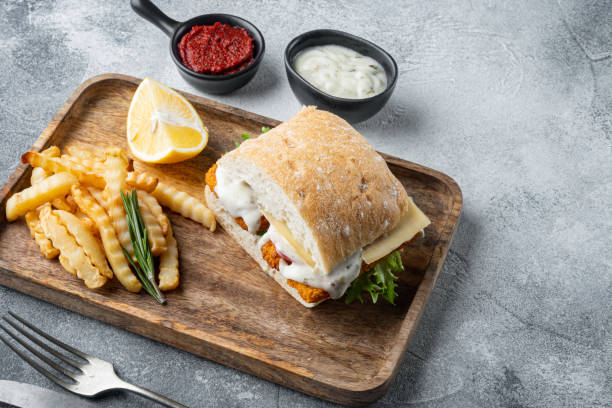 istock Sandwich with Fish Sticks, on gray background , with copyspace  and space for text 1367119334