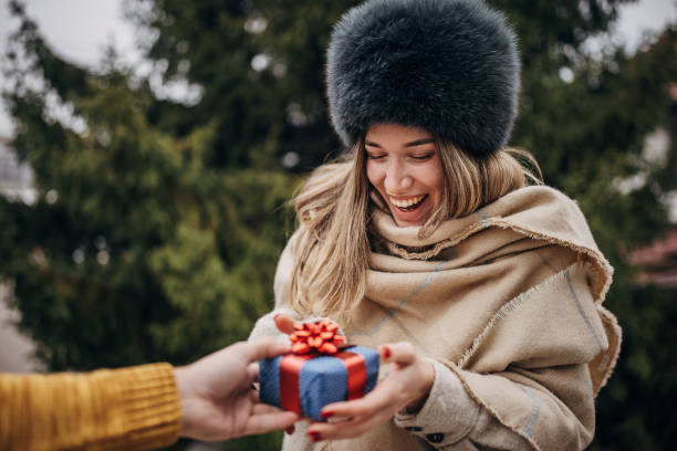 istock Woman receiving a Christmas present 1367120697