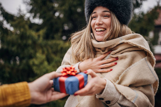 istock Woman receiving a Christmas present 1367120732