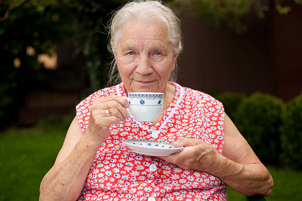 istock Beautiful senior woman drinking tea 136712095