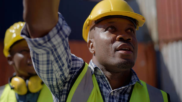 istock Africa America worker open check container working in the port 1367121063