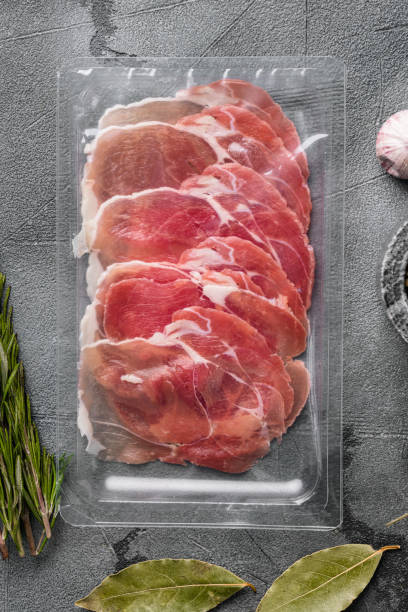istock Traditional Spanish cuisine cured pork meat pack, on gray stone table background, top view flat lay 1367121079