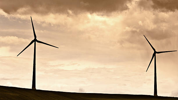 istock Wind Turbine Sillhouette Against Sunset Sky With Clouds 136712228