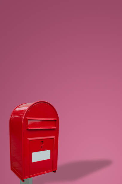 istock Cover page with big fancy red metal postbox with white empty note space for address isolated at pink gradient background with copy space. Concept of communication and post service. 1367124515