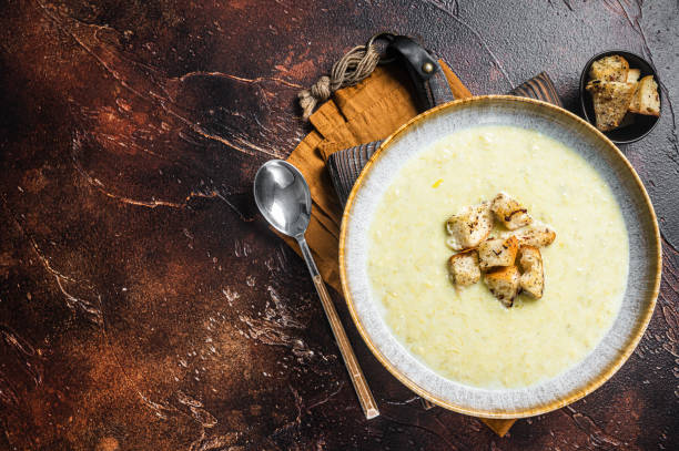 istock Leek soup Vichyssoise with croutons. Dark background. Top view. Copy space 1367126012