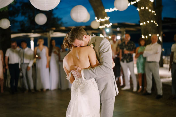 istock Rear View Of Couple Standing Against Blurred Background 1367130535