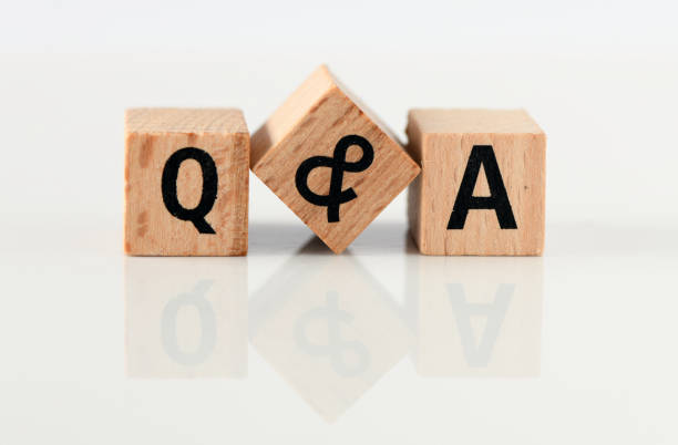 istock Q and A - short for question and answer. The word q & a arranged from wooden letters. 1367130607