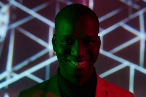 istock Happy young African man with toothy smile looking at camera 1367132387