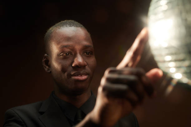 istock Happy young African man touching discoball 1367132507