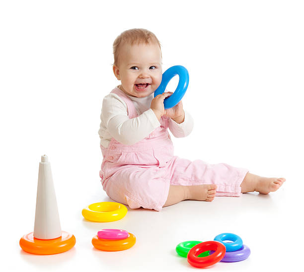 istock baby playing with color toy 136713442