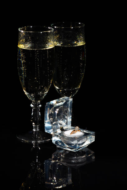 istock Two glasses in wine and a ring in a box 1367134512