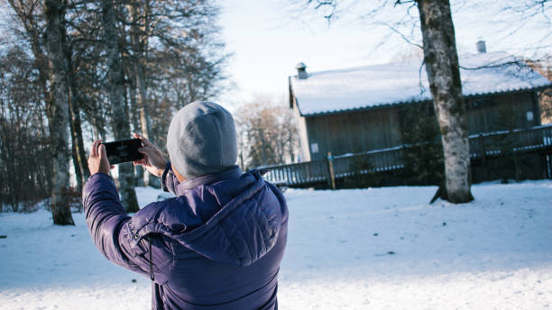 istock young man on vacation in mountains taking selfie 1367135323