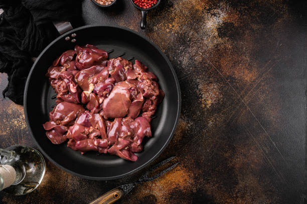 istock Raw chicken liver, on old dark rustic table background, top view flat lay, with copy space for text 1367135656