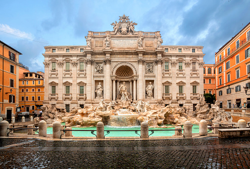 Rome, Italy - December, 2019: Close up of one of the Tritons at the Trevi Fountains in Rome. The fountains were designed by Nicola Salvi and completed by Giuseppe Pannini in 1762.