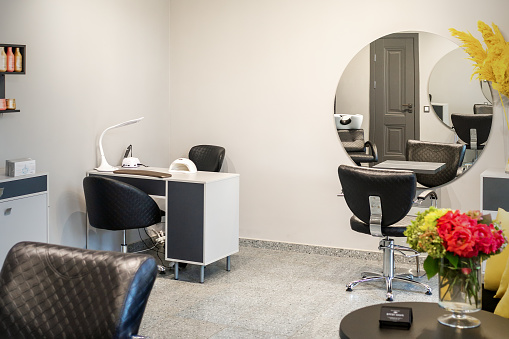 Interior of modern bright hair salon, manicure salon, or beauty salon