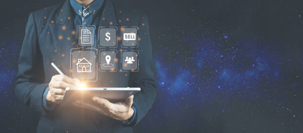 istock Businessman using a computer for property sales listings. 1367143932