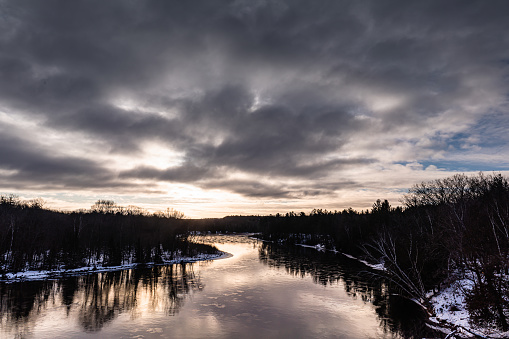 Solo hiking on the Au Sable River during winter snow storm