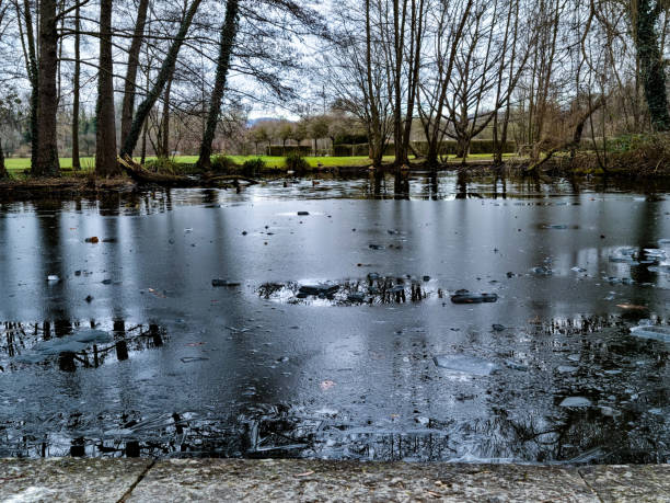 Frozen pond, lake that is thawing