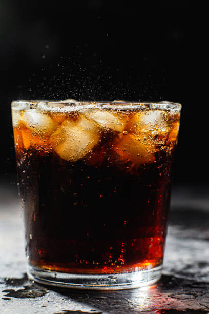 istock Cocktail with ice in a glass on a dark background 1367145901