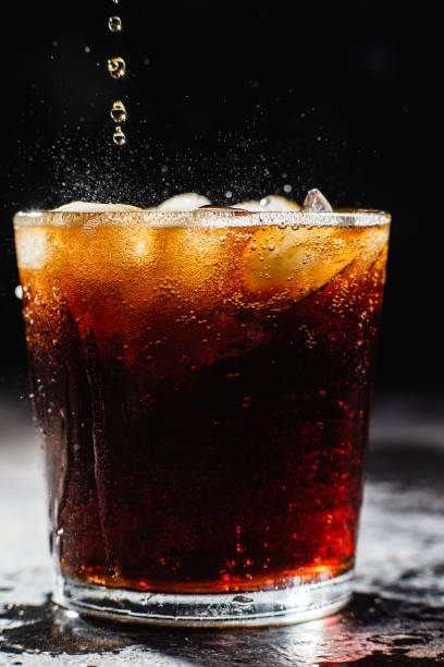 istock Cocktail with ice in a glass on a dark background 1367145916