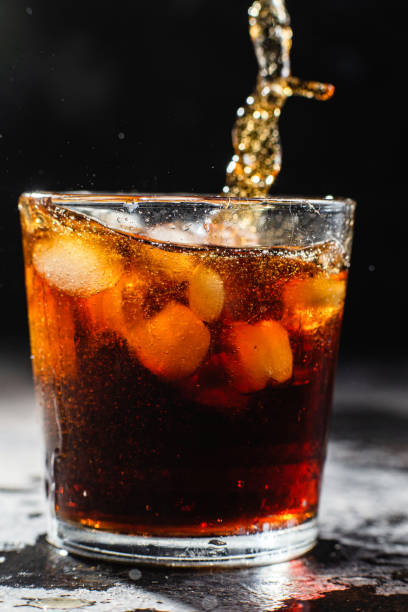 istock Cocktail with ice in a glass on a dark background 1367145940
