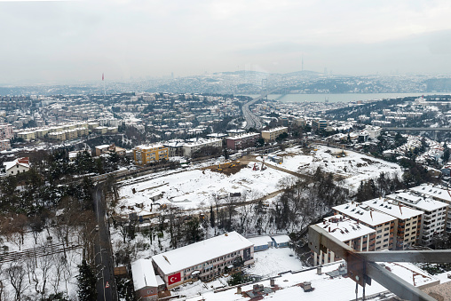 Buildings and roads under white snow and cold winter in Istanbul City.