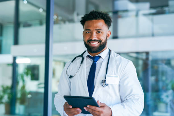istock Shot of a young male doctor using a digital tablet at work 1367150202